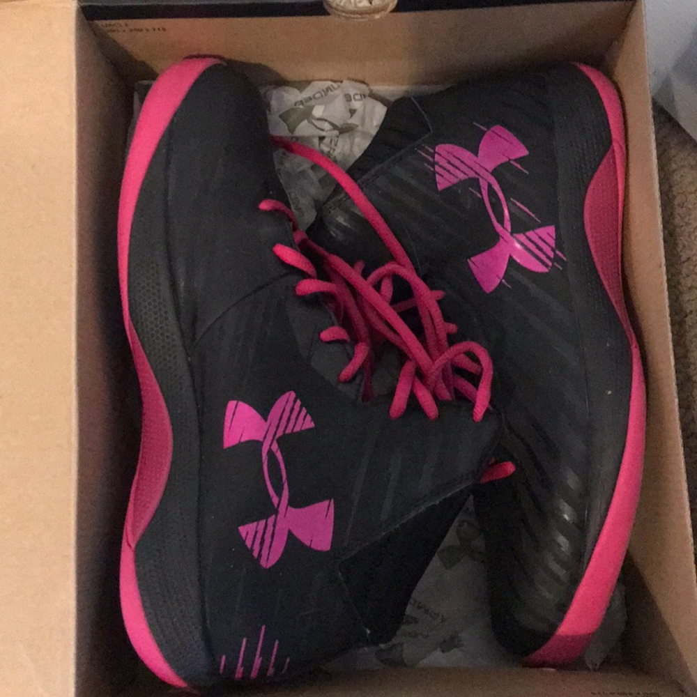 Pink and black Under Armor basketball shoes